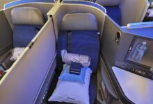 What is the difference between business and first class luxury flights